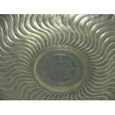Metal dish, wavy sun rays, solar symbol in the center